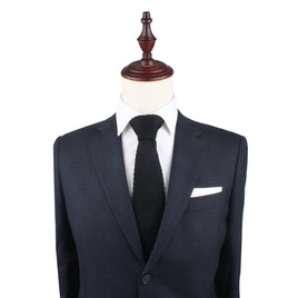 A classic black Knitted Skinny Tie on a mannequin dummy.