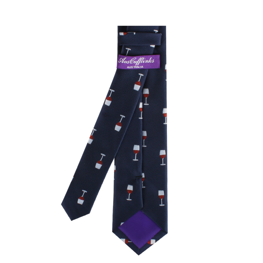 The Wine Skinny Tie, featuring a dark design adorned with a small wine glass pattern and complemented by a sophisticated purple inner lining, exudes modern charm. It includes an "AustCufflinks" label, making it ideal for those with refined taste.