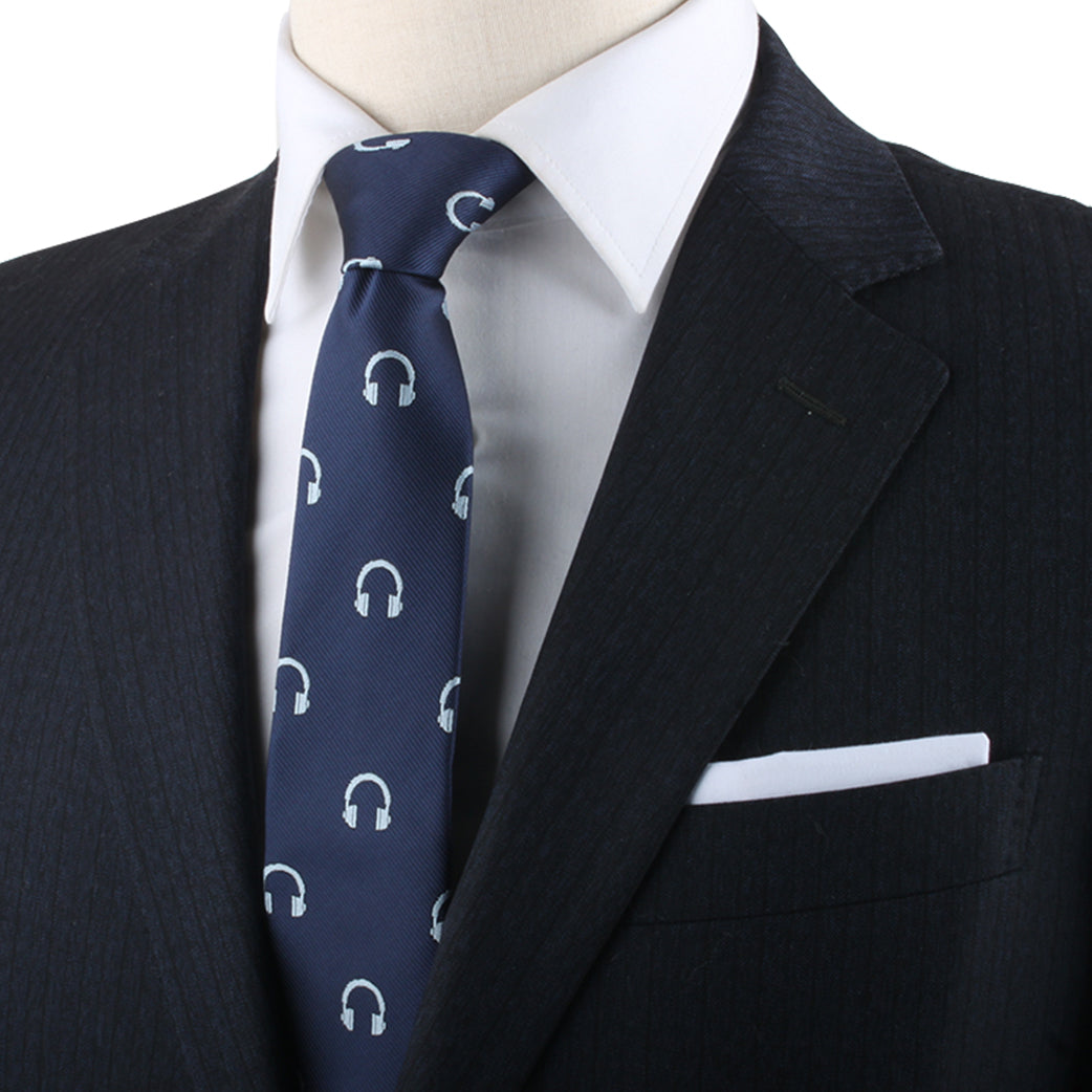 A mannequin exuding contemporary elegance while wearing a blue suit with a Headphone Skinny Tie.