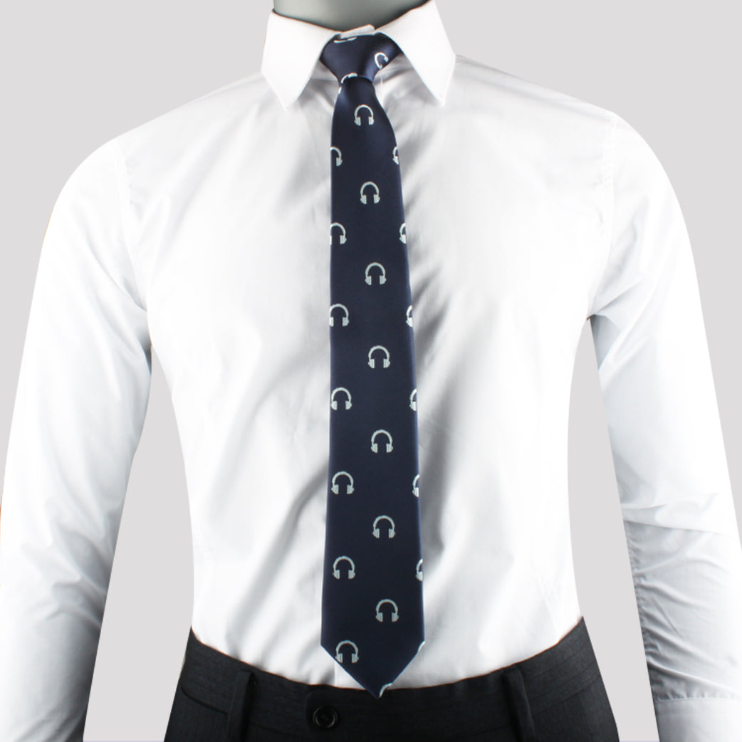 A mannequin showcasing contemporary elegance with a white shirt and Headphone Skinny Tie.