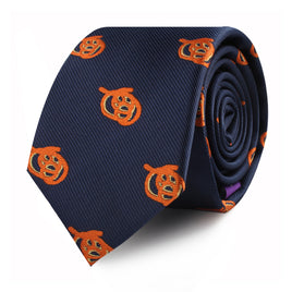 A rolled-up Pretzel Skinny Tie in navy blue featuring orange pumpkin motifs, adding a twist of seasonal charisma.