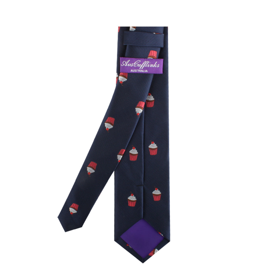 The Muffin Skinny Tie, with its navy color and small red cupcake patterns, makes a delectable style statement and features a purple interior label that reads "Auster Winks Australia.