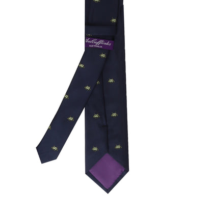 A Green Space Invader Skinny Tie with a modern style purple flower on it.