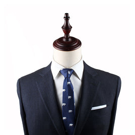 Mannequin dressed in a dark pinstripe suit, white dress shirt, and Polar Bear Skinny Tie, exuding an air of elegance against a pristine white background.