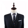 A mannequin dressed in a dark suit and a crisp white shirt, featuring the Burger Skinny Tie, makes a statement of universally adored quirky style.