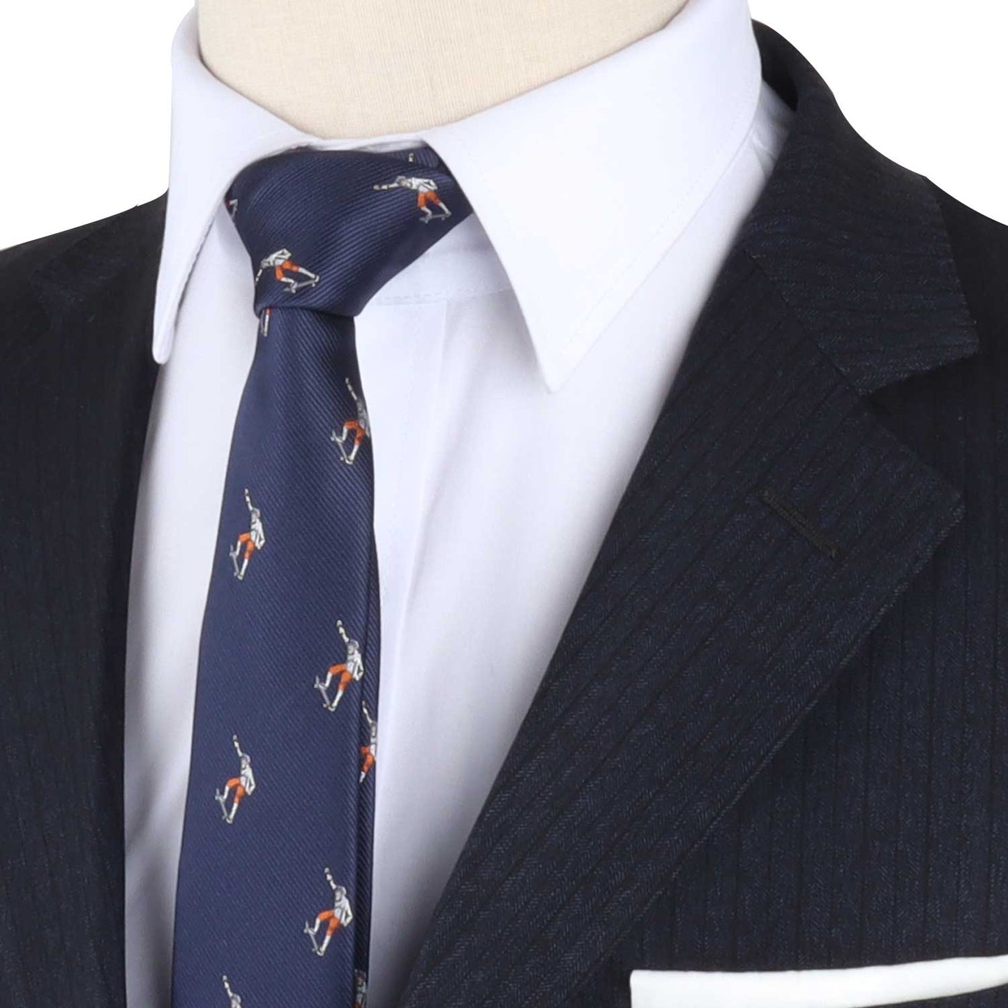 Close-up of a dressed mannequin wearing a white dress shirt, a dark blue suit jacket, and the Skateboarder Skinny Tie with small printed figures that roll down with flair.