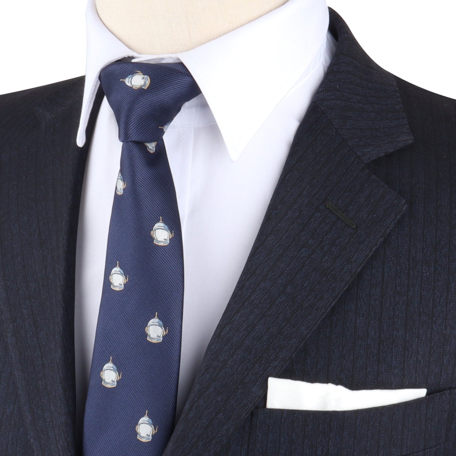 Close-up of a suit with a white shirt, the Spaceman Skinny Tie featuring helmet designs that elevate the look, and a white pocket square.