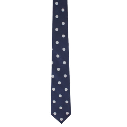 The Golf Ball Skinny Tie, featuring a navy blue color and a golf-themed pattern of white polka dots, is an ideal choice for those looking to add a playful touch to their outfit.