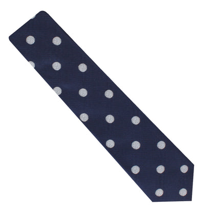 A Golf Ball Skinny Tie in navy blue, adorned with white polka dots, perfect for enthusiasts of classic style.