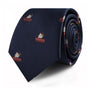 The Cake Skinny Tie in a rolled navy design features embroidered books and a candle, enhancing your attire with a touch of elegance.