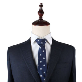 Mannequin wearing a dark pinstripe suit, white shirt, and the Golf Ball Skinny Tie—perfect for style enthusiasts with a keen eye for sophistication.