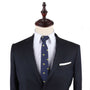 A suit with a Camel Skinny Tie and pocket square on a mannequin, exuding urban elegance.