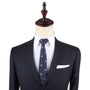 Displayed on a mannequin, the Gamer Face Skinny Tie complements a dark suit jacket and white shirt, offering an effortless way to elevate your fashion game.