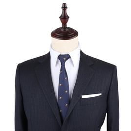 A dashing blue suit with a Horse Racing Skinny Tie leads the way on a mannequin, exuding elegance.