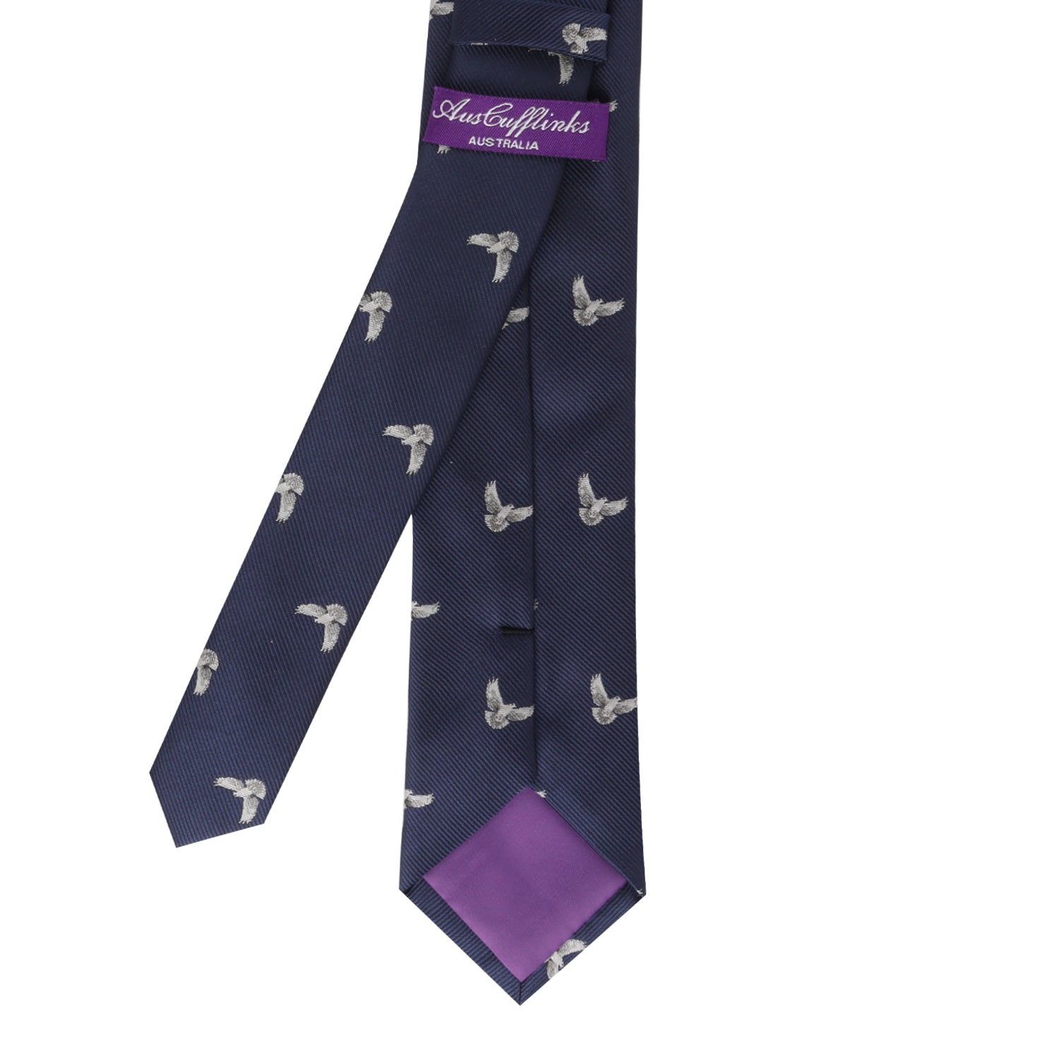 A Dove Skinny Tie featuring a subtle bird pattern, with a purple AusCuffsLinks Australia label and purple inner lining at the tip—an exquisite piece that seamlessly blends peace and style.