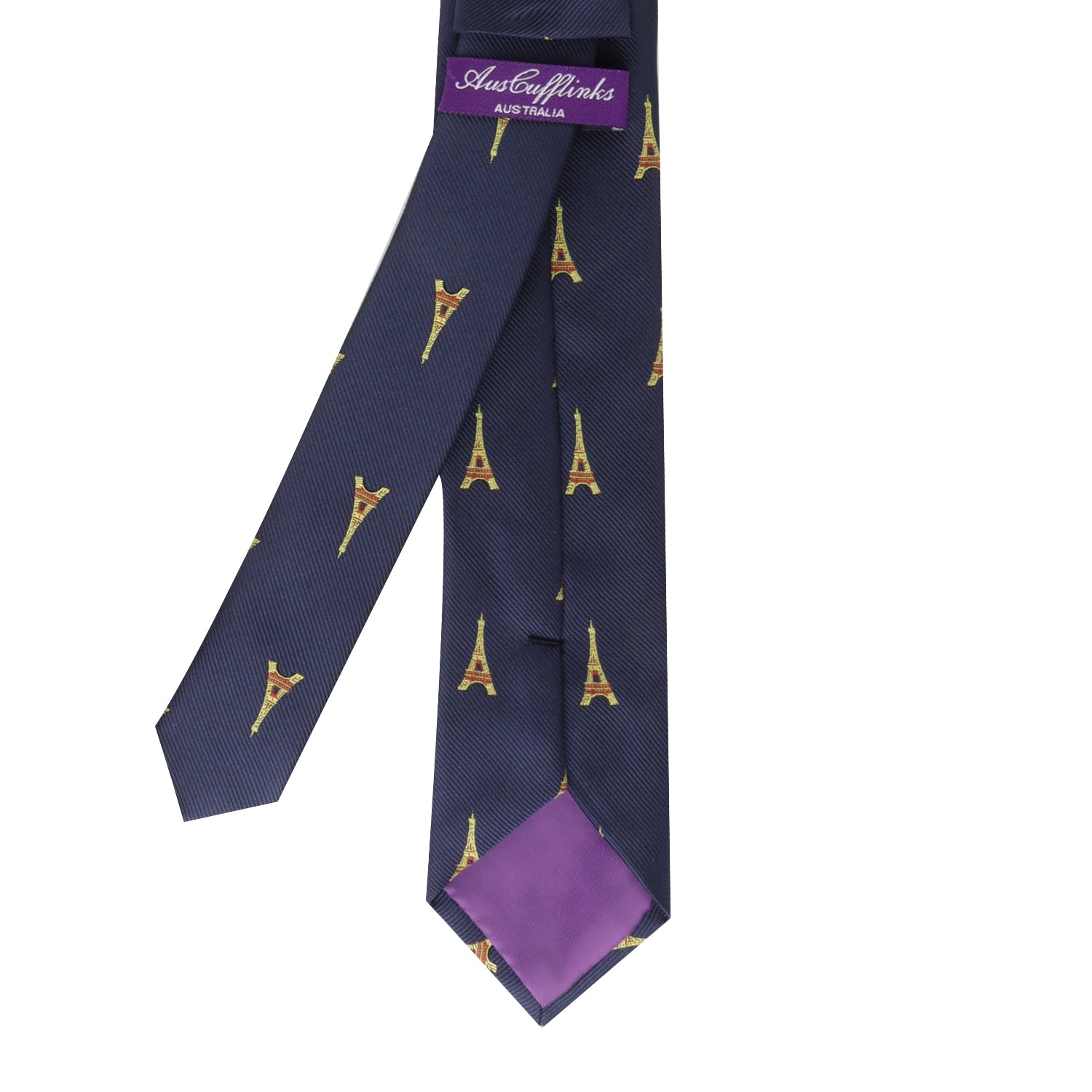 The Eiffel Tower Skinny Tie is a navy blue accessory adorned with yellow Eiffel Tower prints and finished with a purple inner lining, embodying Parisian elegance.