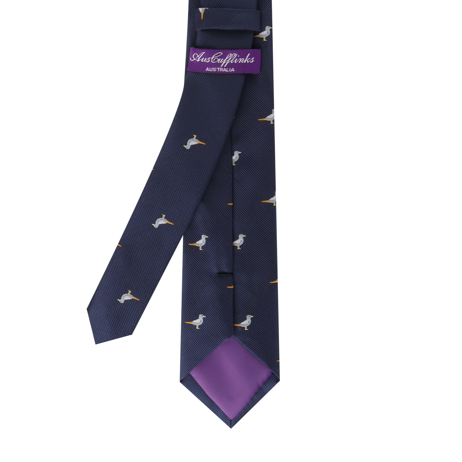 The Seagul Skinny Tie, in dark blue with a seagull pattern, effortlessly captures the essence of skyward flight. It features a purple inner lining and is labeled "AuzCufflinks Australia," allowing your style to soar coast to coast.