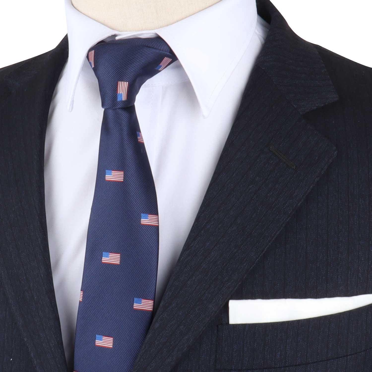A close-up of a mannequin exuding style, adorned in a dark pinstripe suit and white shirt, featuring the American Flag Skinny Tie that evokes patriotism, complemented by a crisp white pocket square.