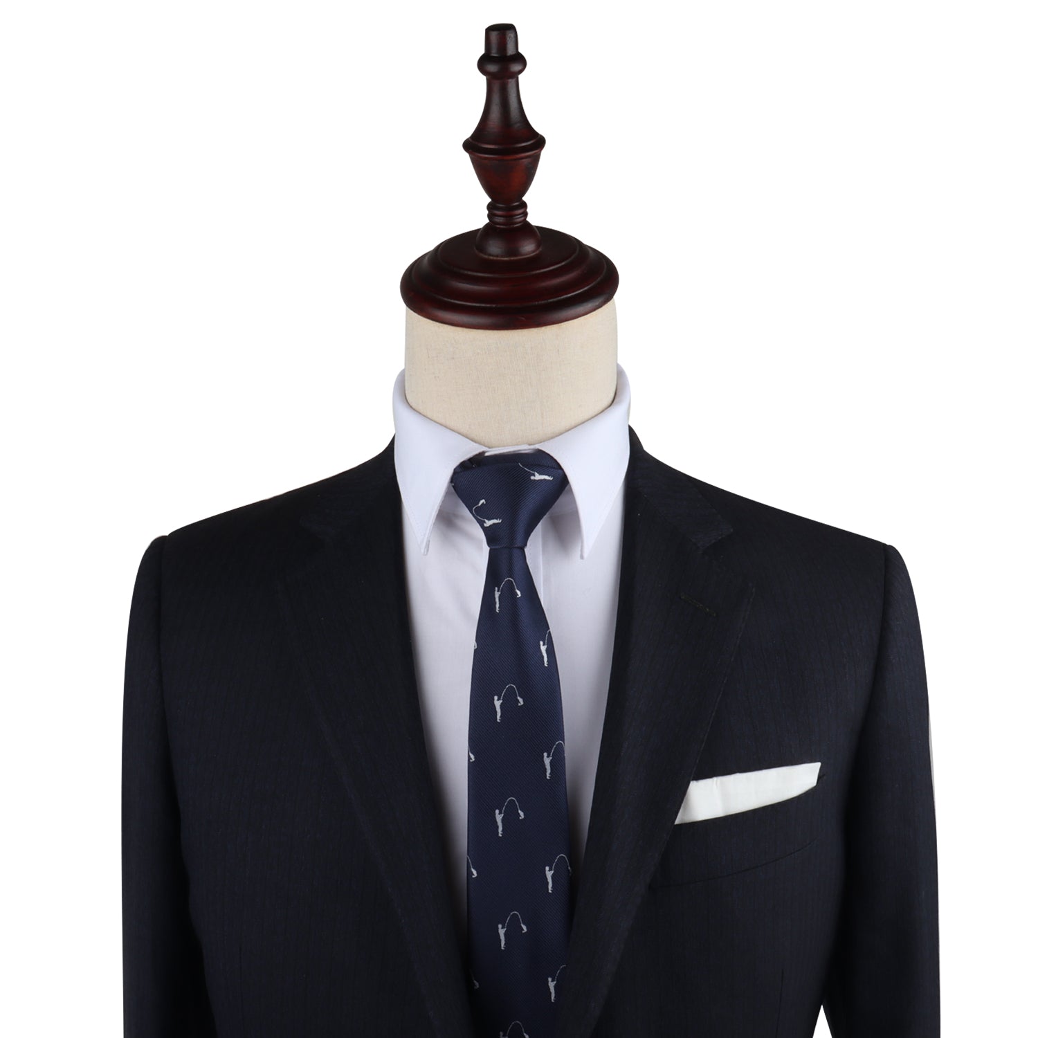 A mannequin dressed in a dark suit with a white dress shirt, a Angler Skinny Tie featuring a subtle pattern, and a white pocket square effortlessly compliments its refined look.