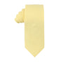 A neatly folded, Baby Yellow Skinny Cotton Tie with a smooth texture and a sharp silhouette, positioned vertically against a white background.