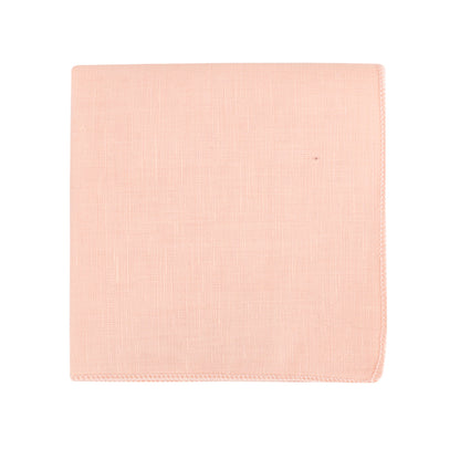 A folded piece of fabric in a gentle pastel peach hue is presented against a white backdrop, suggesting a dual-style ensemble. Introducing the Baby Pink Bow Tie and Pocket Square Set.