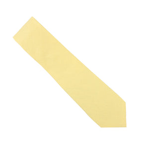 A Baby Yellow Skinny Cotton Tie with a matte finish, featuring a standard width and pointed tip, stands out against a white background, creating a striking silhouette.