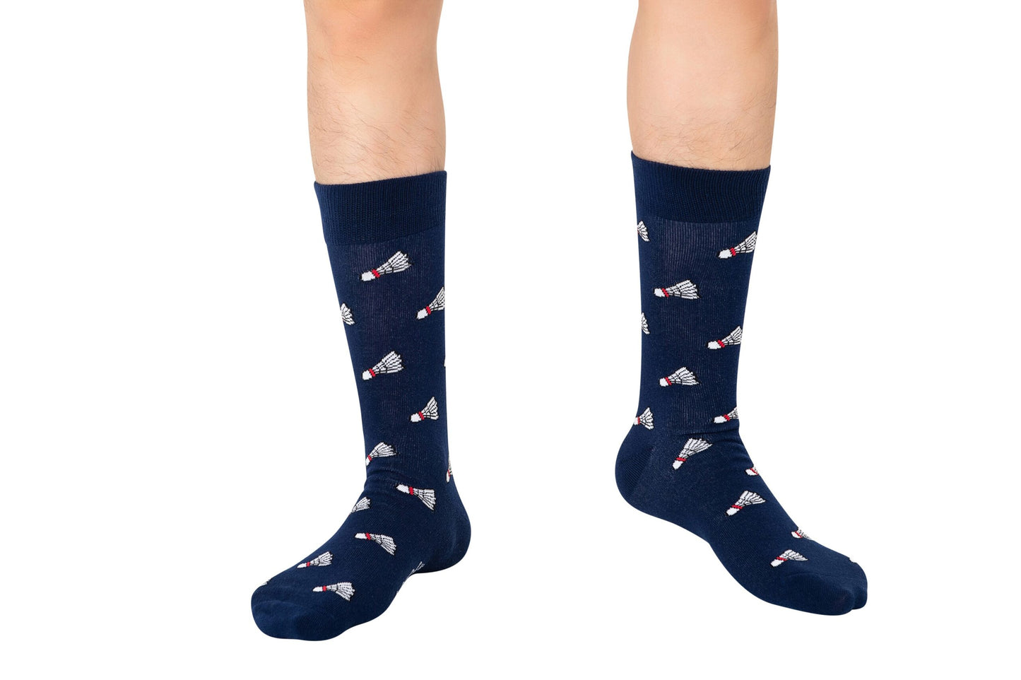 A pair of legs wears Badminton Socks in navy blue with a repeating shuttlecock print, displayed on a white background.