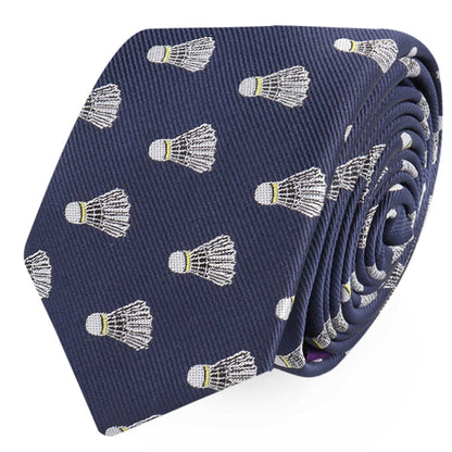 A rolled-up navy blue Badminton Skinny Tie featuring a repeated pattern of white and yellow shuttlecocks that looks sharp enough to score compliments.