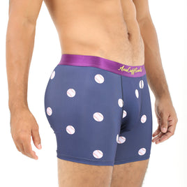 A person hitting a home run in comfort and style while wearing Baseball Underwear, featuring navy boxer briefs adorned with pink polka dots and a purple waistband.