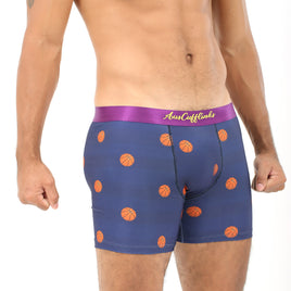 A person wearing Basketball Underwear in blue with orange basketball patterns, ideal for providing ultimate comfort both on and off the court.