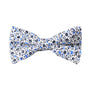 A bow tie from the Black Light Blue Floral Cotton Bow Tie & Pocket Square Set, showcasing a white background adorned with a black and blue floral design.