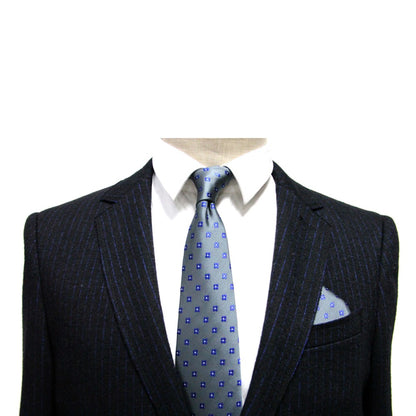 A headless mannequin dressed in a black pinstripe suit, a white shirt, a Blue Flower Grey Business Tie & Pocket Square Set exudes subdued charm.