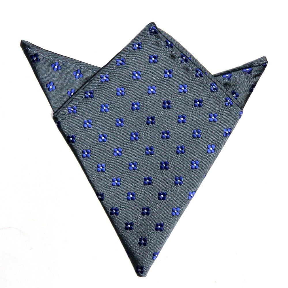 A Blue Flower Grey Business Tie & Pocket Square Set with a pattern of blue dots, neatly folded with pointed corners, exuding a tasteful appeal and subdued charm.