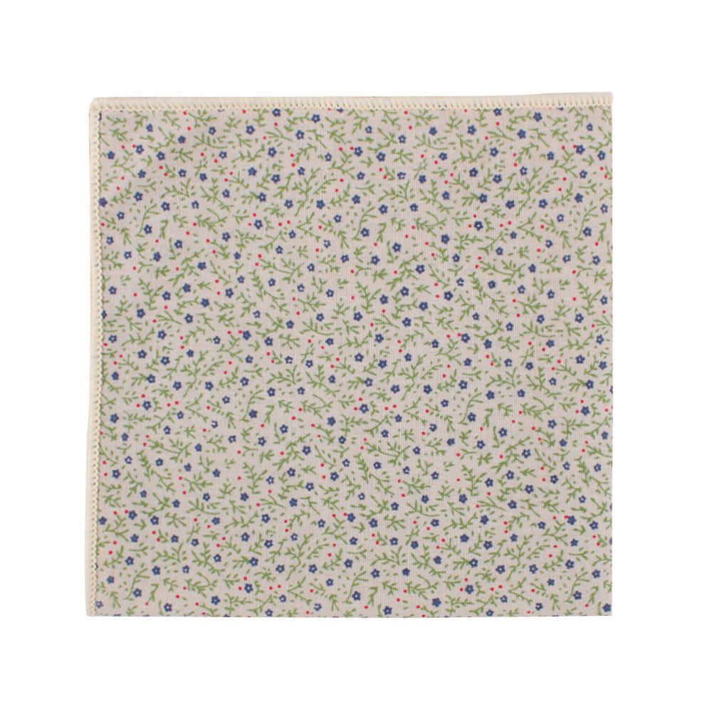 A square piece of fabric adorned with an elegant pattern showcasing delicate pink, blue, and green florals comes as part of the Blue Forget-Me-Nots Cotton Floral Skinny Tie & Pocket Square Set.