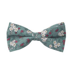A blue bow tie with an elegant white and pink floral pattern, perfect for the distinguished gentleman.