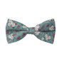 A blue bow tie with an elegant white and pink floral pattern, perfect for the distinguished gentleman.