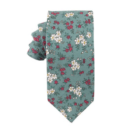 A blue necktie featuring a timeless design adorned with a floral pattern of white and pink flowers.