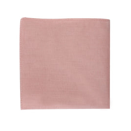 A blush pink pocket square on a white background, adding a touch of standout style.