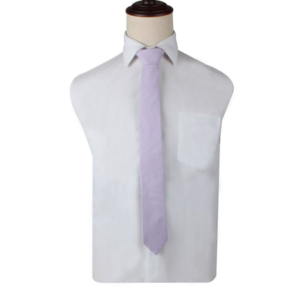 On a mannequin torso, a luxury white dress shirt features a front pocket, complemented by the Blush Purple Skinny Necktie and Pocket Square Set.