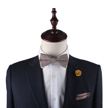 A mannequin with a timeless suit and Brown Mini Houndstooth Bow Tie.