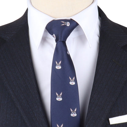 A person exudes charming sophistication in a dark pinstripe suit and white shirt, accessorized with the Bunny Skinny Tie, which features a playful pattern of cartoon rabbit faces.