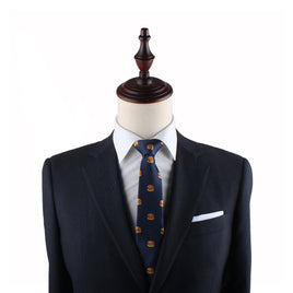 A mannequin dressed in a dark suit and a crisp white shirt, featuring the Burger Slim Tie, makes a statement of universally adored quirky style.