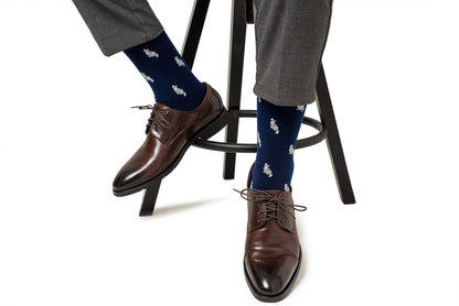 A person's legs and shoes adorned with Cat Socks.