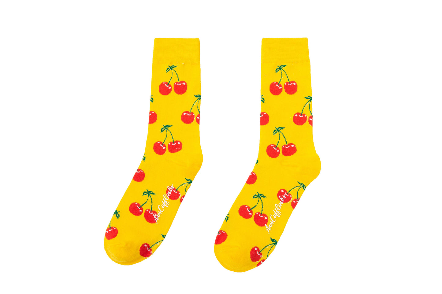 A pair of yellow Cherry Socks with red cherries on them.