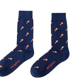 These navy socks, named "Strawberry Cake" feature a layered style with an orange drumstick pattern and "Happy Holidays" embroidered on the toes.