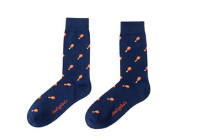 These navy socks, named "Strawberry Cake" feature a layered style with an orange drumstick pattern and "Happy Holidays" embroidered on the toes.