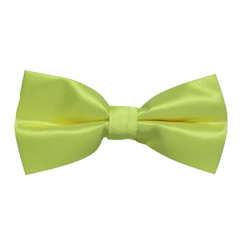 The Classic Lime Green Bow Tie, with its smooth, textured surface and neatly tied center, makes a bold statement.