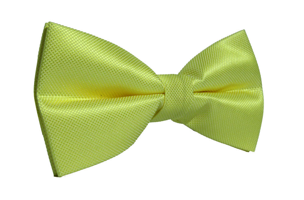 A close-up view of the Classic Lime Green Bow Tie made of textured fabric, making a bold statement against a white background.