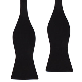Two untied Classic Cotton Black Self-Tie Bow Ties lay on a white background, ready for formal events.