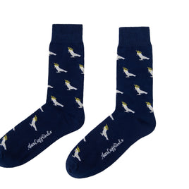 A pair of Cockatoo Socks, with white and yellow birds on them.